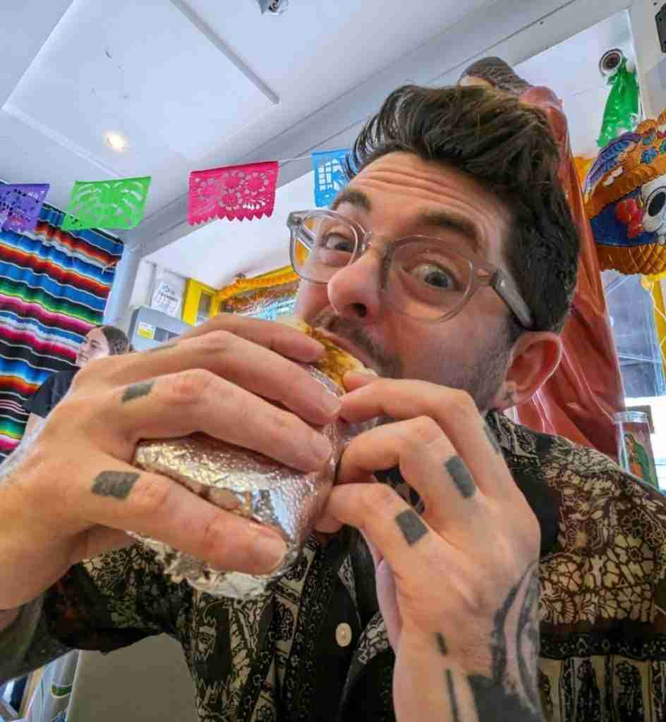 Mitch Smith, eating a burrito