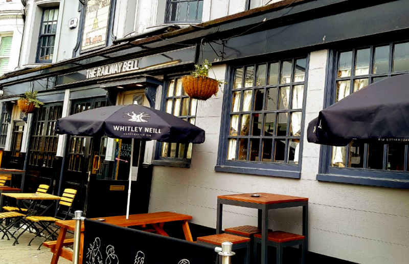 exterior shot of the railway bell, traditional english pub with outside seating
