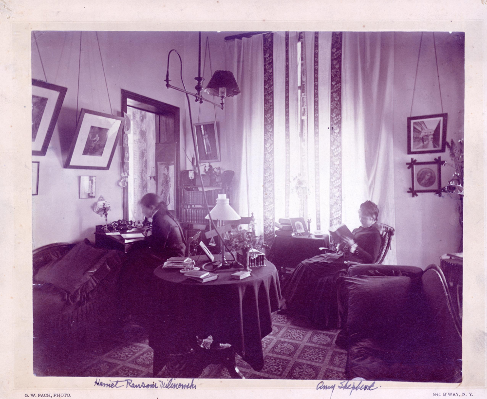 old timey film photograph, black and white of two female students sitting in a vintage American dorm room