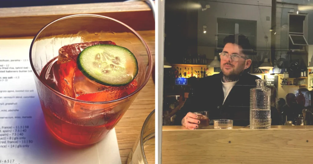 two images combined, on the left is a simple negroni cocktail with a cucumber topping. On the right is a man sitting in the window of a restaurant drinking the negroni.